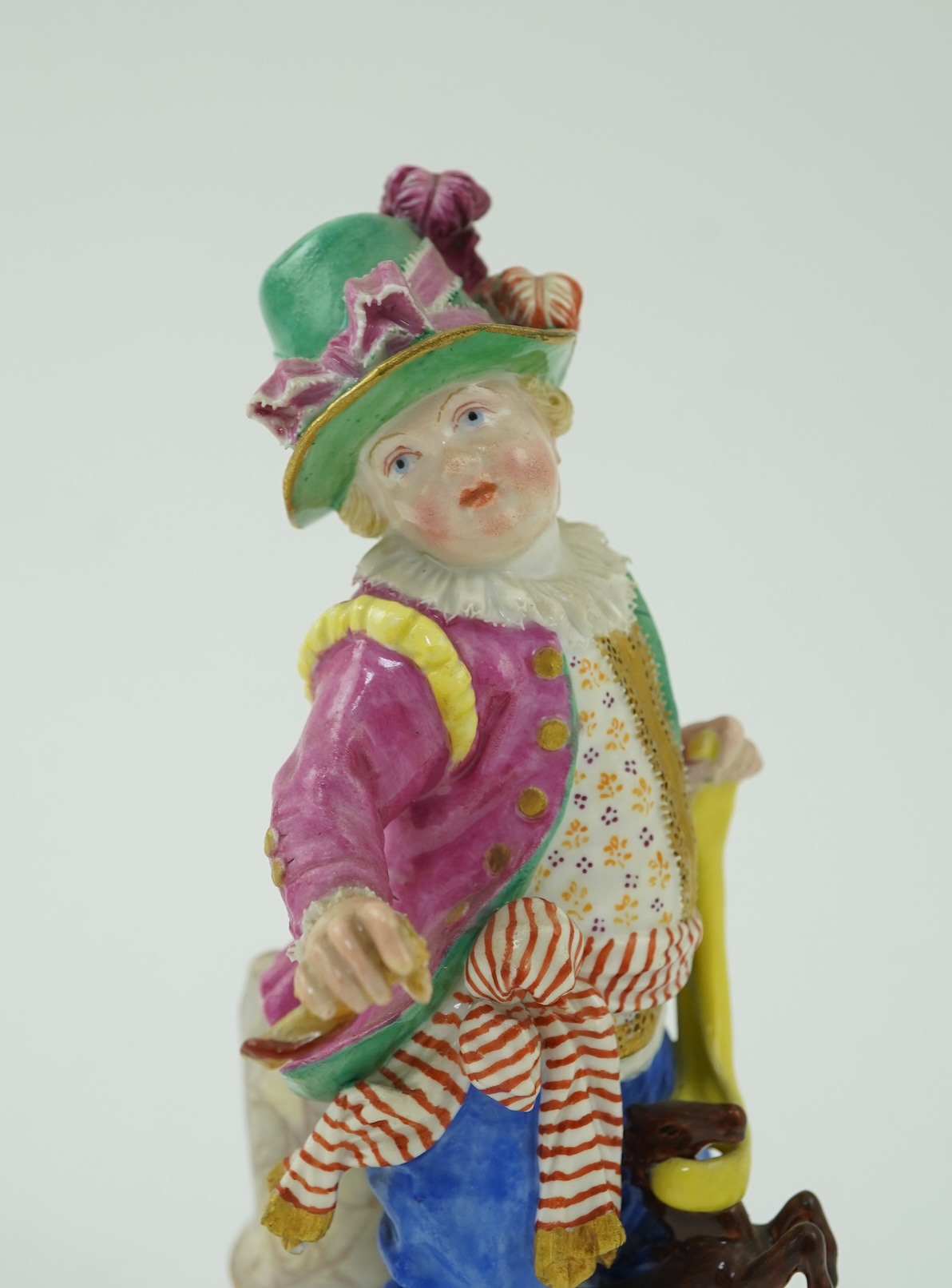 A Meissen figure of a boy on a hobby horse, 19th century